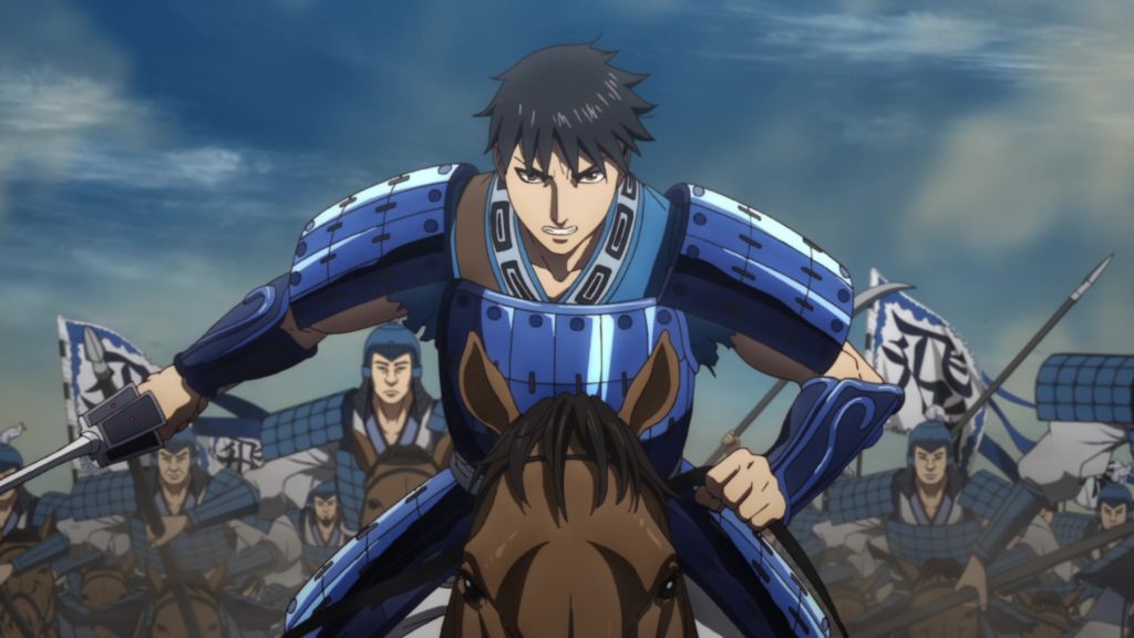Un samurai in armatura blu, a cavallo ed alla guida di un esercito