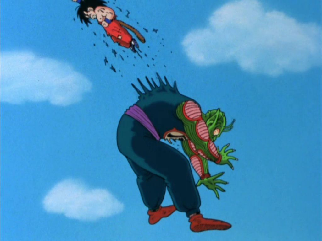 Goku sfonda l'addome di Al Satan con un montante in un combattimento aereo.