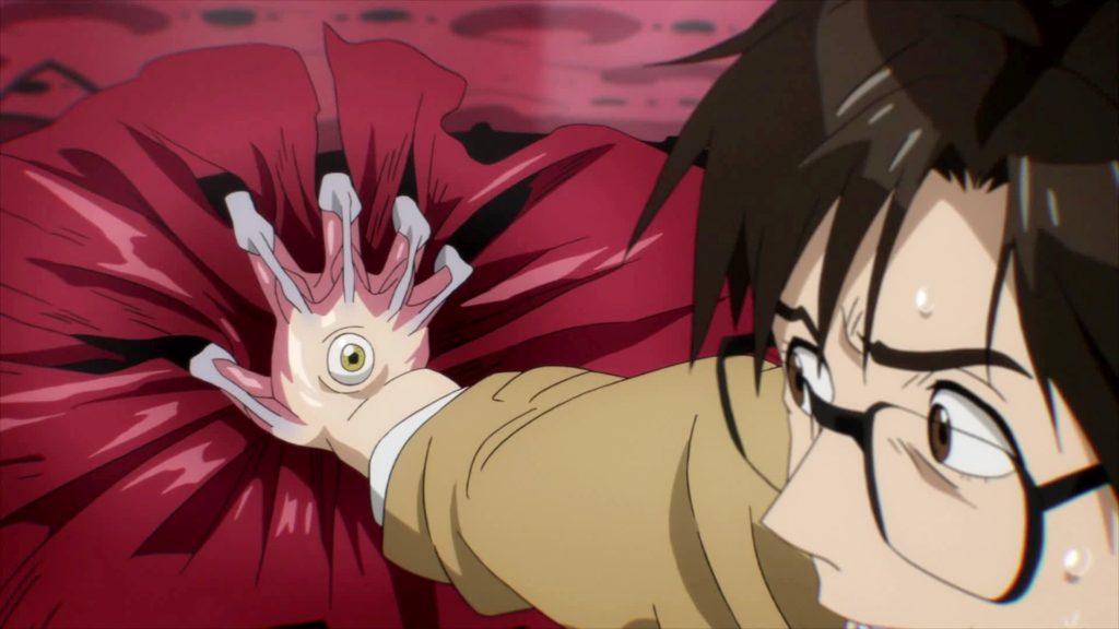 Shinichi insieme al parassita che alberga nella sua mano